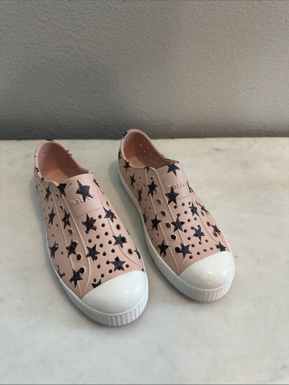 Native Shoes Kids Slip-On Sneakers in Pink with Black Star Print